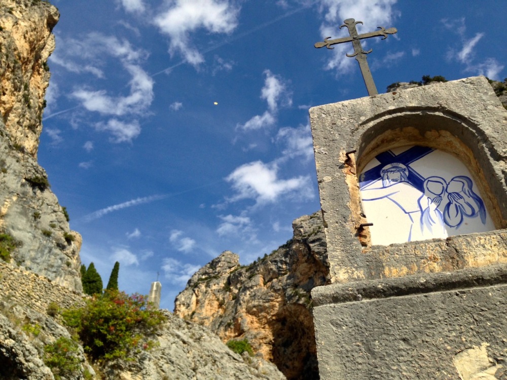 one of the stations of the cross, with the chapel and gold star in the background