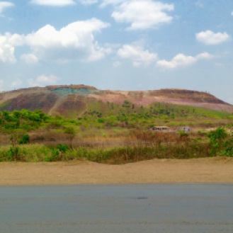 October 2015: A disappearing mountain near the former Green Wall, richly colored with malachite (green) and iron oxide (lilac)